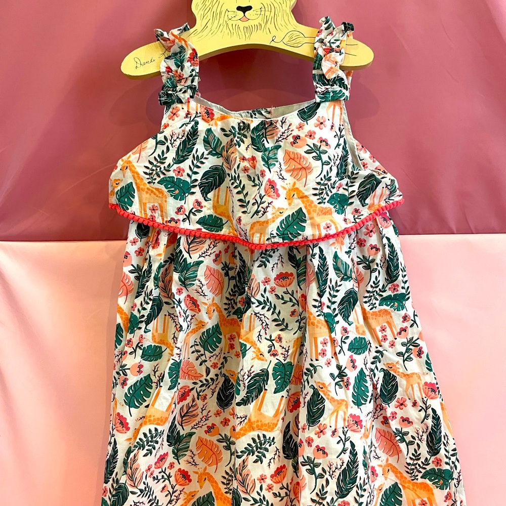 C&C California kid’s dress with giraffe print and small Pom Pom trim.